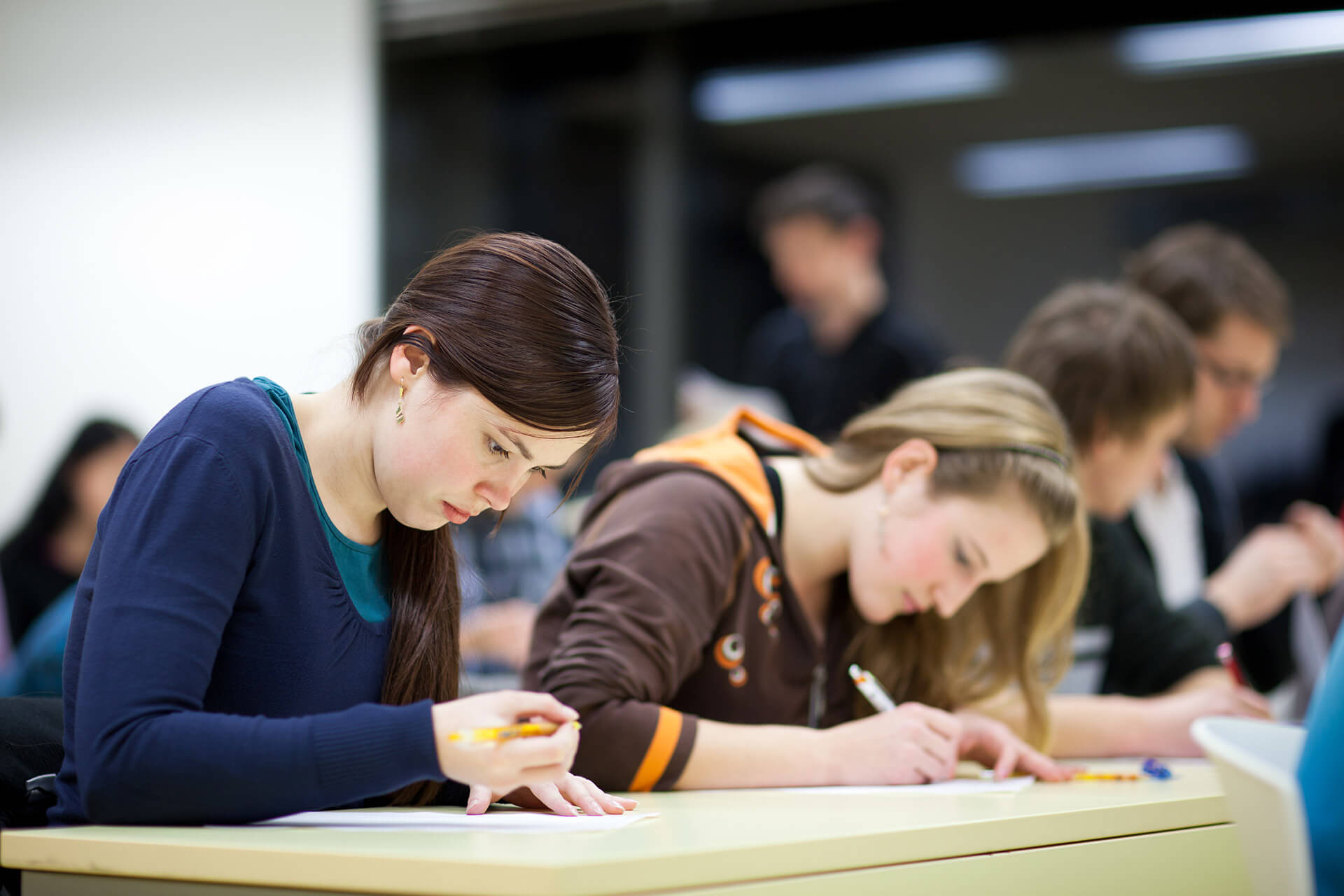 Female college student sitting in a classroom