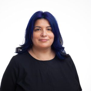 woman with dark purple hair and black blouse