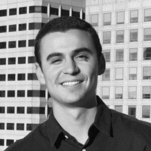 young man with short black hair and black shirt