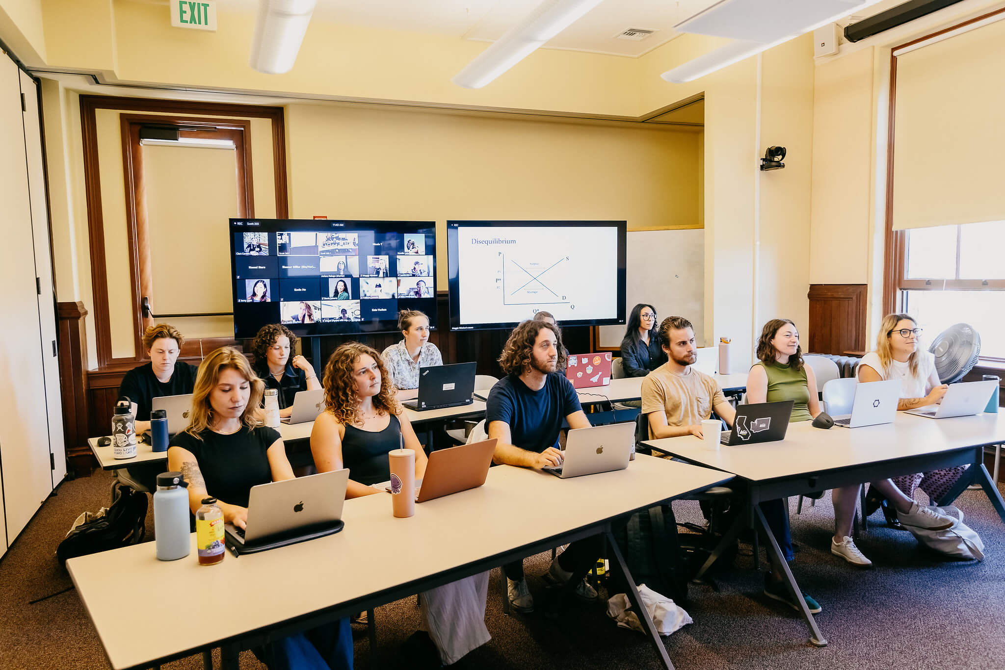 group of men and women in classroom learning about sustainability issues